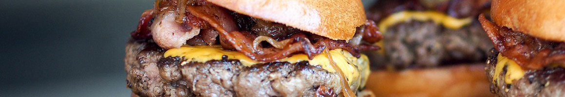 Eating American (New) Burger Sandwich at Picnikins restaurant in San Antonio, TX.